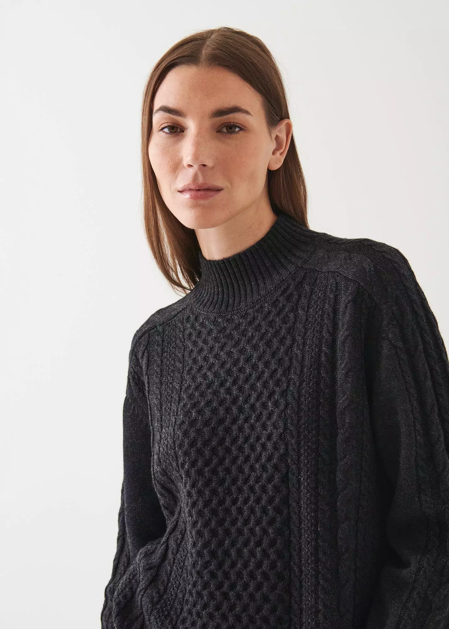 CABLE KNIT MOCK NECK SWEATER